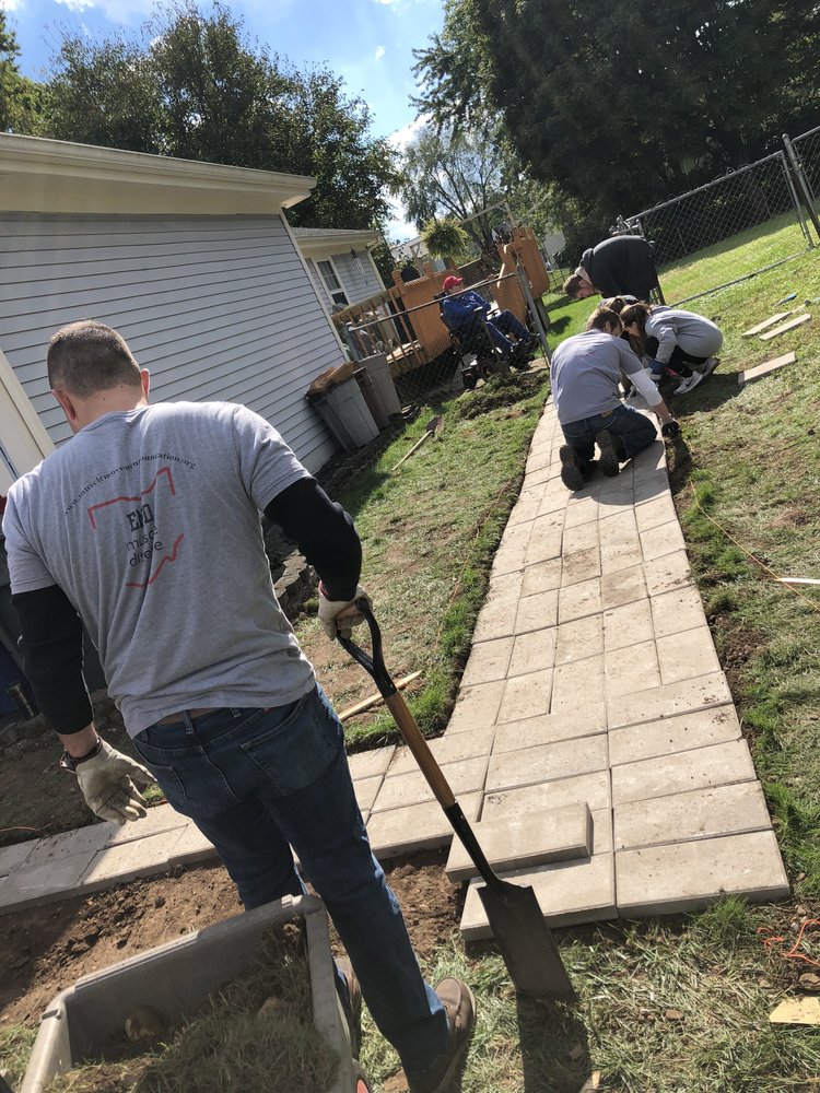 Students at Ohio State University construct a wheelchair ramp for a local MMF Muscle Champion.